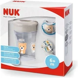 NUK Magic Cup & Space Set mit pädagogisch wertvollem, transparentem Teddybär-Becher, 230ml & Schleife & Schnullerplatz für 6+ Monate in grau
