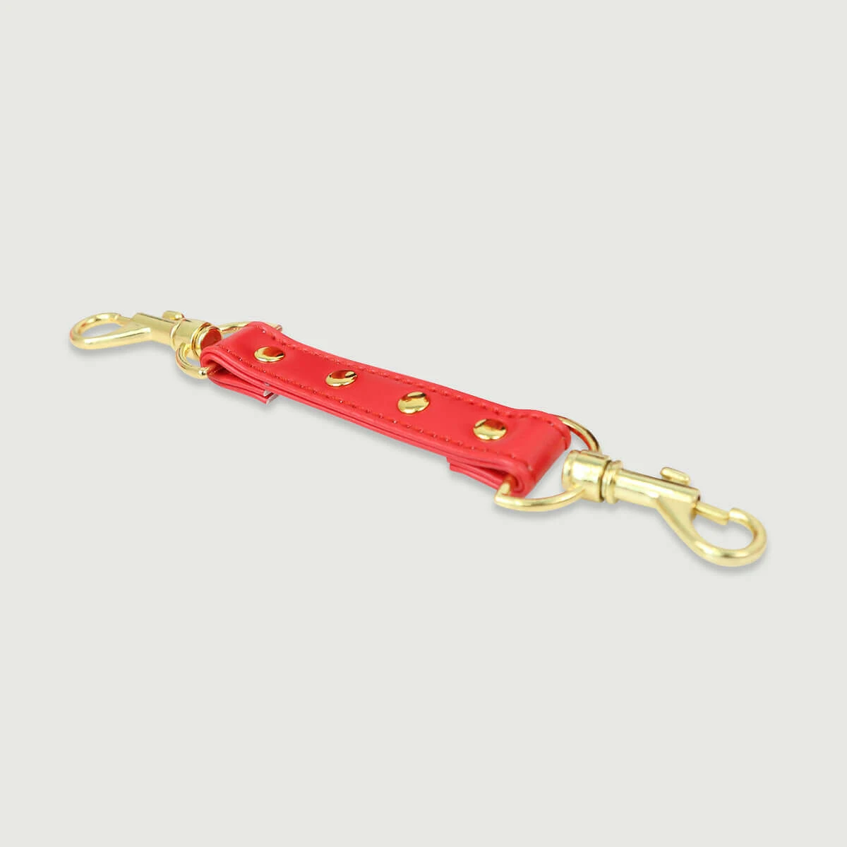 Leder-Verbindungsstange für Hand- oder Fußgelenke mit Goldhaken - rot